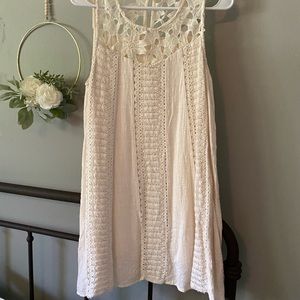 Off white , sleeveless dress.